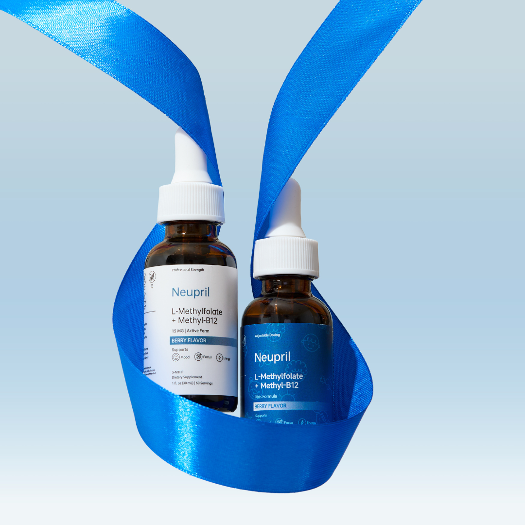 Two amber glass dropper bottles of Neupril L-Methylfolate and Methyl-B12 liquid supplements—one original and one Kids Formula—cradled inside a looping bright blue silk ribbon against a light blue gradient background